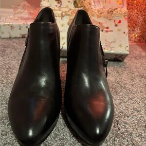 Woman’s high heel bootie. Black size 8